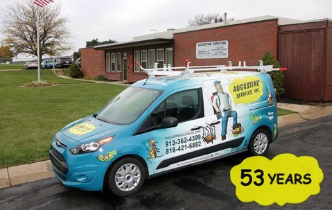 augustine services company vehicle parked outside of a commercial facility